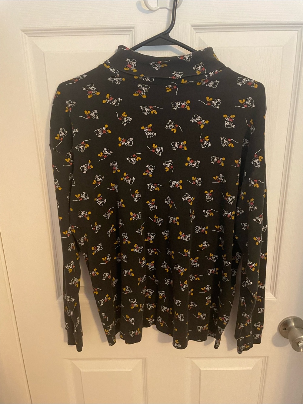 Womenโs Black Long-Sleeve Tee with Playful Cartoon Print